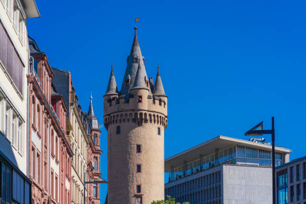 Frankfurt am Main. July 6, 2023. Tradition and modernity meet in Frankfurt am Main Innenstadt District. View of Eschenheimer Tower medieval city gate.