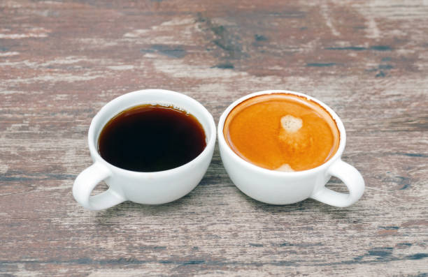 istock Two coffee cup, Americano coffee and espresso coffee on wooden table 2158982506