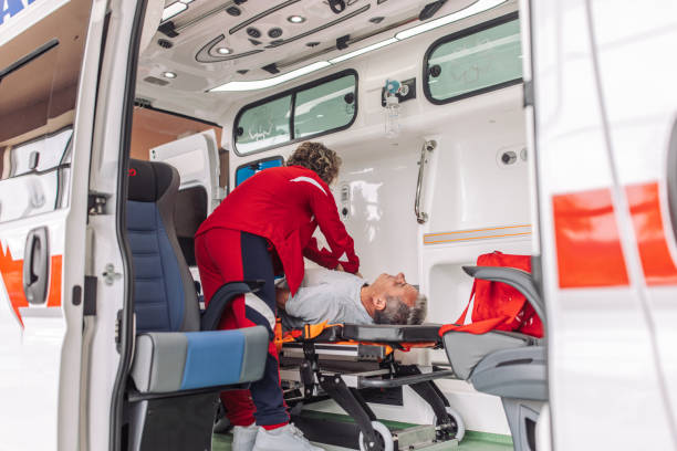 istock Paramedic assisting injured patient inside ambulance 2158984526