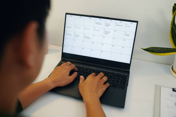 istock Businessman Checking His Timetable On Laptop 2158984715