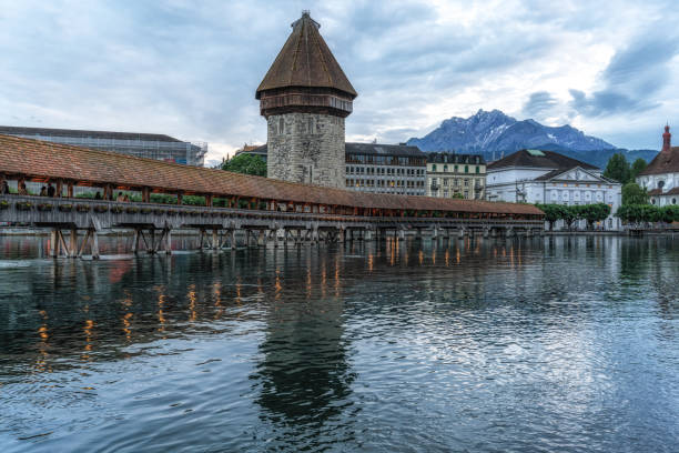 the view of chapel bridge and mount pilatus over the Reuss river. Famous landmark in Lucerne, Switzerland