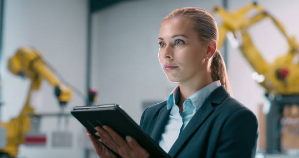 istock Engineering, manufacturing or woman with tablet, robotics or app for production check or innovation project. Research, future or process automation consultant with technology or machine or inspection 2158987912
