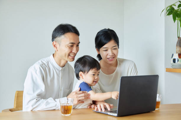 Children and parents play with computers and smartwatches