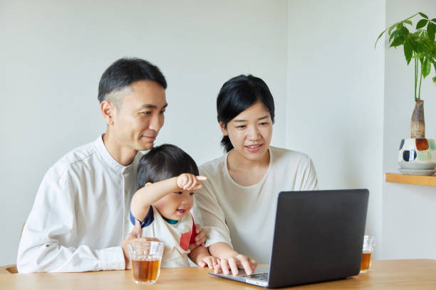 istock Children and parents play with computers and smartwatches 2158989263