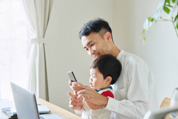 istock Children and parents play with computers and smartwatches 2158989274