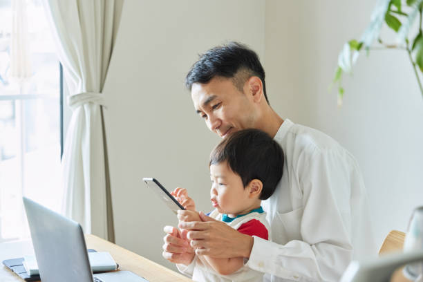 istock Children and parents play with computers and smartwatches 2158989275