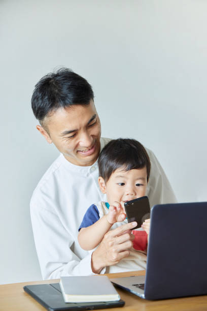 istock Children and parents play with computers and smartwatches 2158989281