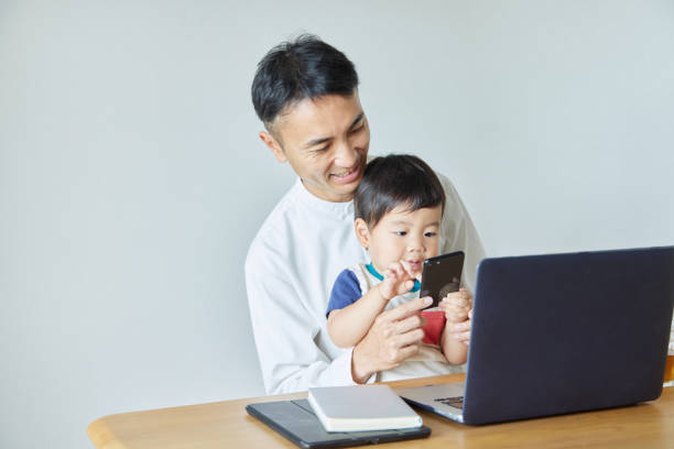 Children and parents play with computers and smartwatches