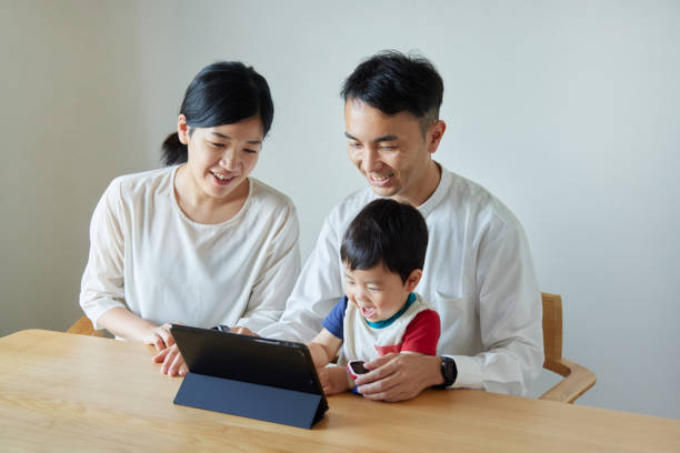 istock Children and parents play with computers and smartwatches 2158989310