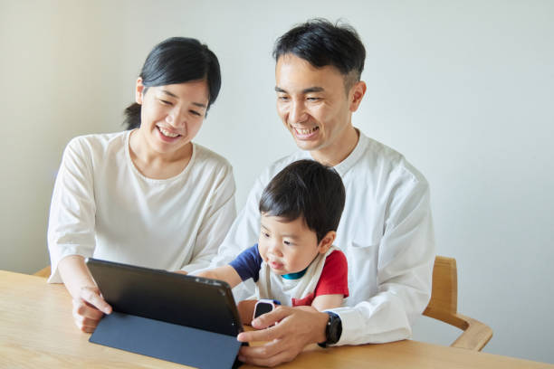 istock Children and parents play with computers and smartwatches 2158989360