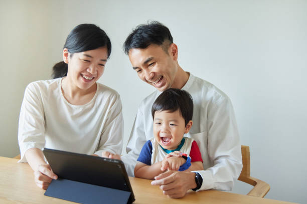 istock Children and parents play with computers and smartwatches 2158989376