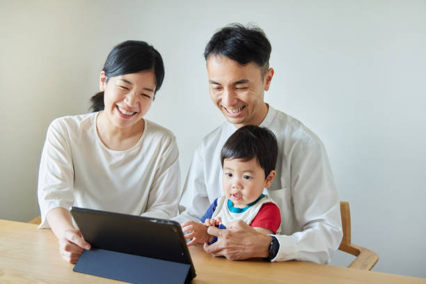 istock Children and parents play with computers and smartwatches 2158989378