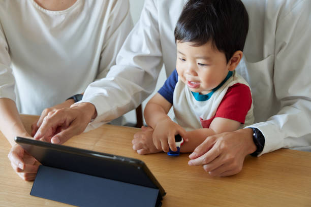 istock Children and parents play with computers and smartwatches 2158989379