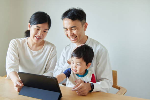 istock Children and parents play with computers and smartwatches 2158989384