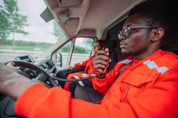 istock Paramedics driving ambulance using walkie talkie during emergency 2158991229