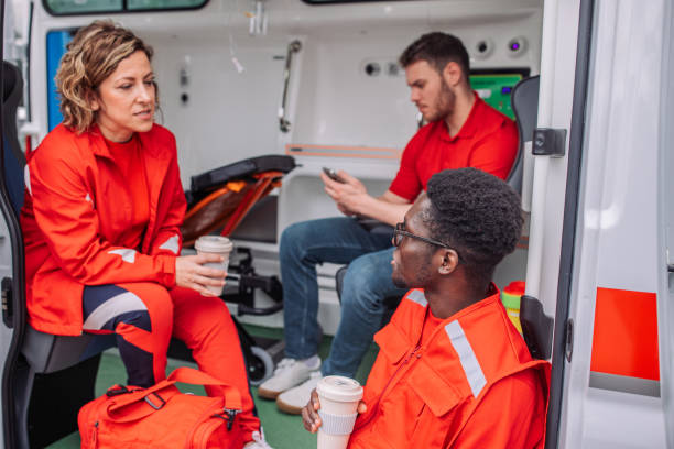 istock Paramedics having a coffee break inside the ambulance after emergency 2158991828