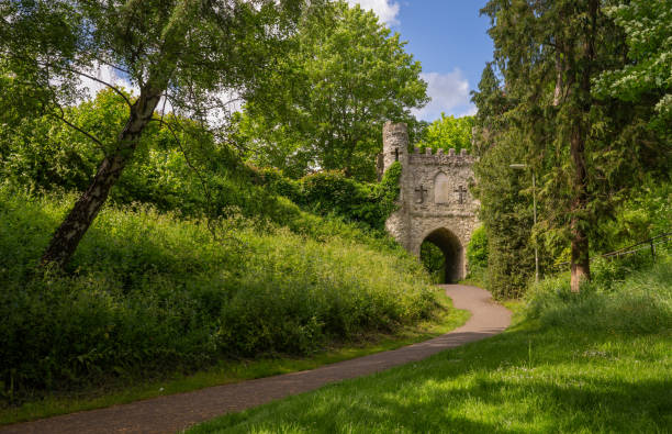 Castle Grounds, a public park in Reigate, Surrey, UK. While the castle no longer exists, a mock medieval gateway was built over the ruins in 1777.