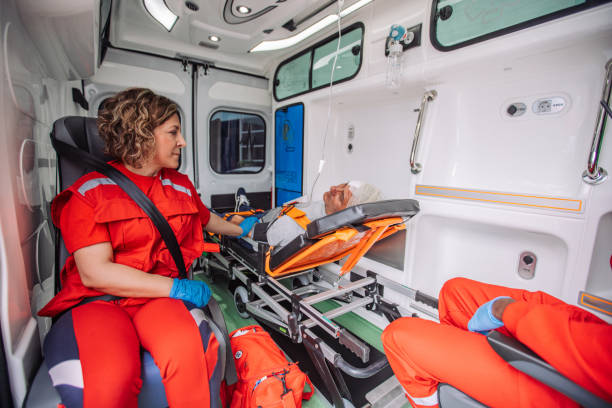 istock Paramedic assisting senior patient lying on stretcher in ambulance 2158993196