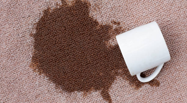 istock Coffee spilled from white cup on the carpet 2158993995