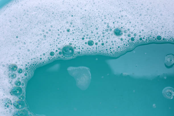 istock Detergent foam bubble on water. Blue background, Soap sud 2158995608