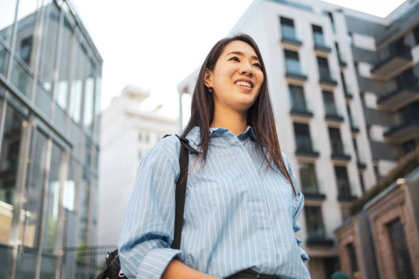 istock Asian woman commuting in the city and using technology 2158996081