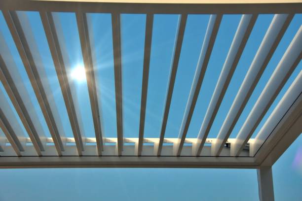istock Photo of a pergola awning bathed in sunlight with copy space image 2158996406