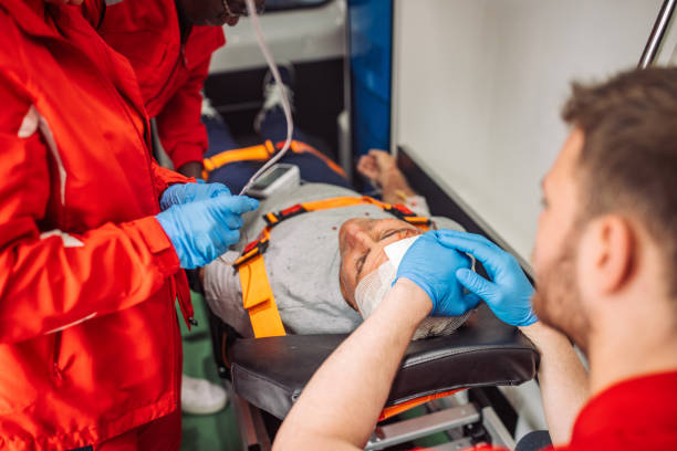 istock Paramedics providing first aid to injured patient in ambulance 2158996896