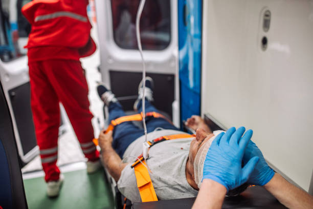 istock Paramedics assisting injured patient inside ambulance 2158996973