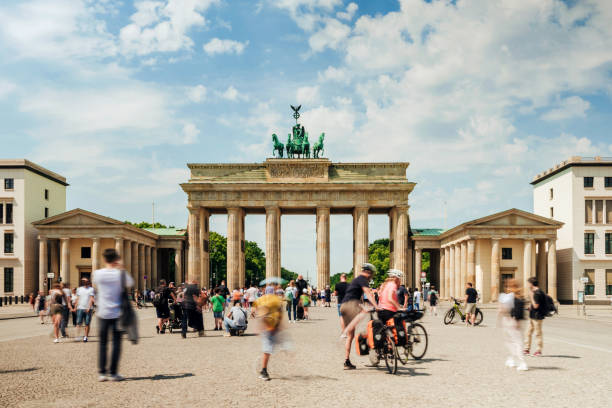 istock motion blurred crowd ot tourists in front of Brandenburg Gate 2159000039