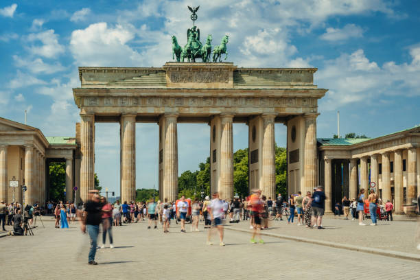 istock motion blurred crowd ot tourists in front of Brandenburg Gate 2159000066