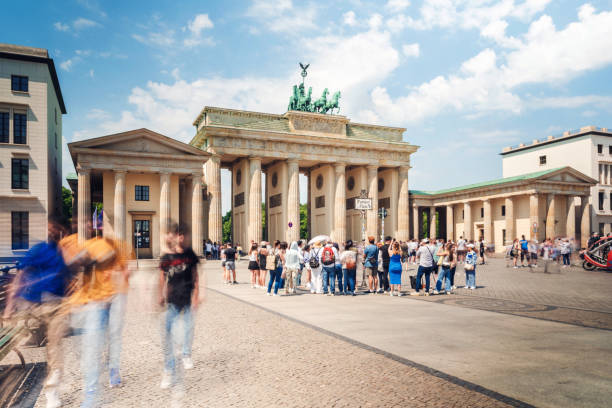 istock motion blurred crowd ot tourists in front of Brandenburg Gate 2159000143