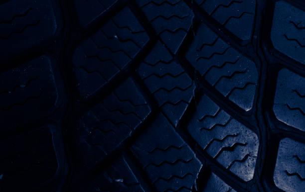 istock tire tread, tire traces background in blue 2159001368