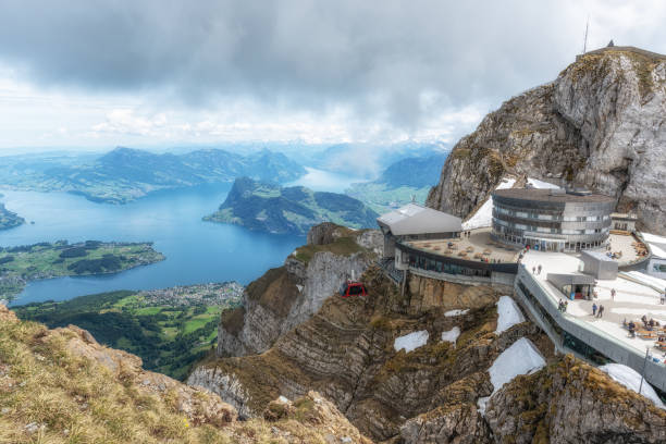 View of Pilatus Cable Car and Hotel Bellevue The view of Pilatus cable car ride and hotel bellevue which is also cable car station. Taken from Mount Pilatus, Switzerland on May 26th 2024 lucerne switzerland stock pictures, royalty-free photos & images