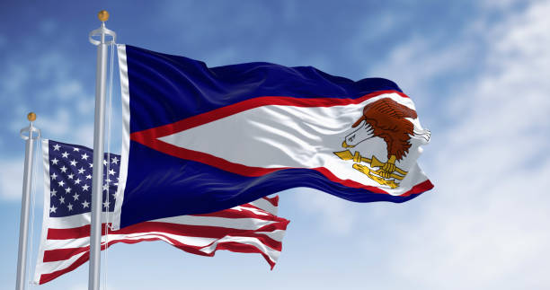 istock The American Samoa flags waving with american flag on a clear day 2159008063