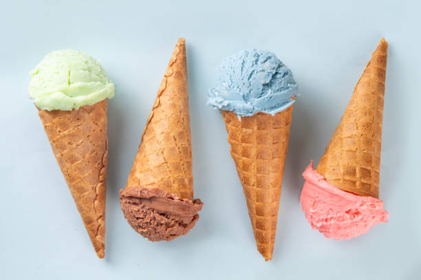 istock Colorful bright ice cream in waffle cones on bright background 2159014155