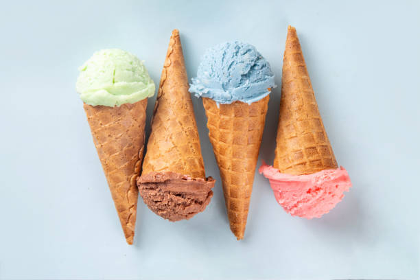 istock Colorful bright ice cream in waffle cones on bright background 2159014157