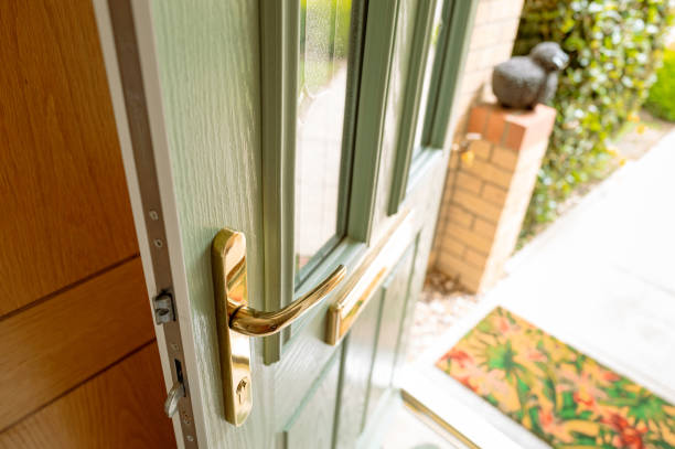 Newly installed, uPVC front door showing the brass fittings. stock photo