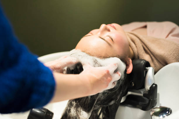 istock Women being shampooed in beauty salons. 2159019565