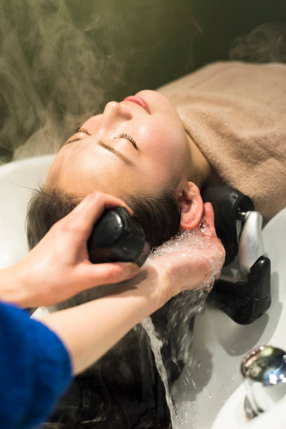 istock Women being shampooed in beauty salons. 2159019753