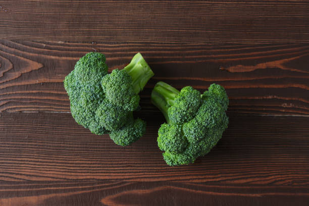 istock Broccoli on dark wooden background 2159019901