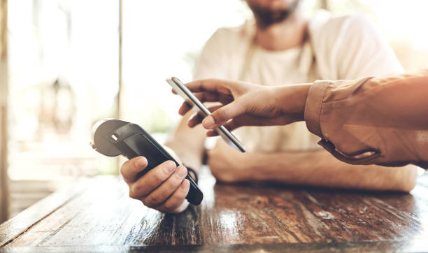 istock Hands, pos and phone at a cafe for payment, ecommerce or coffee shop waiter tip for customer service. Smartphone, scanner and person at a restaurant with app for paperless, bill or digital currency 2159021827