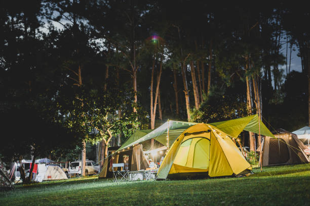 istock Yellow tent at night in campground 2159024163