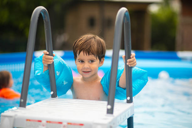 istock Getting ready to get into the swimming pool 2159024167