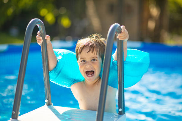 istock Getting ready to get into the swimming pool 2159024199