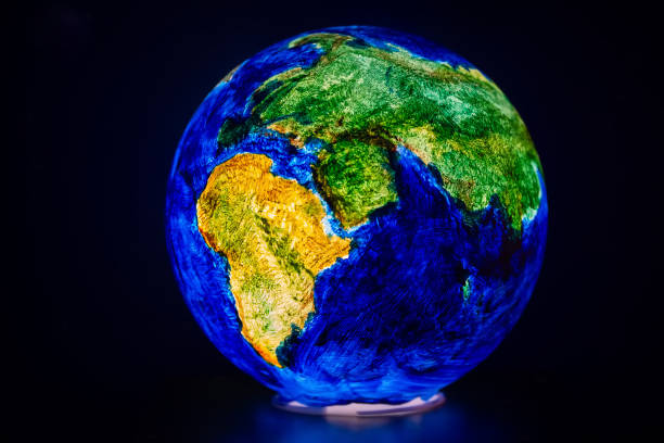 istock The globe is illuminated from the inside on a dark background. 2159025579