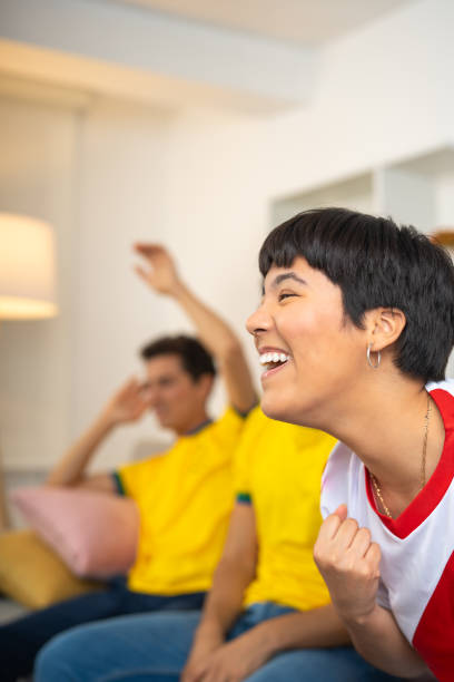 istock Woman happy and laughing because her team won the game 2159027596