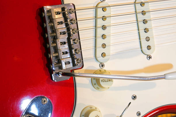istock red and white electric guitar with knobs for volume and tone control and a tremolo bar 2159028024