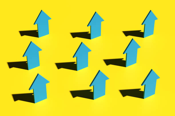 istock Blue directional arrows pointing upwards on yellow background. 2159028165