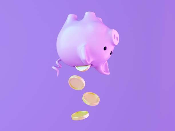 istock Piggy Bank with Coins Falling on Purple Background 2159028236
