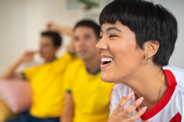 istock Woman excited because her team won the game 2159028352